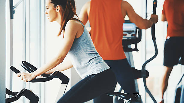 istock Bike exercising in a gym. 612264554