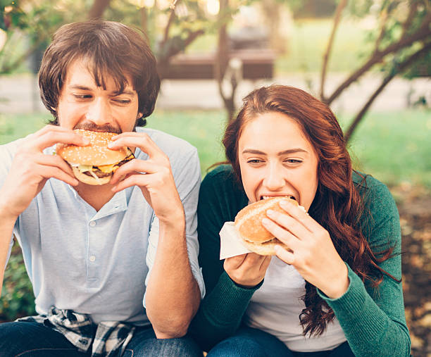 istock Happy couple eating 612264698