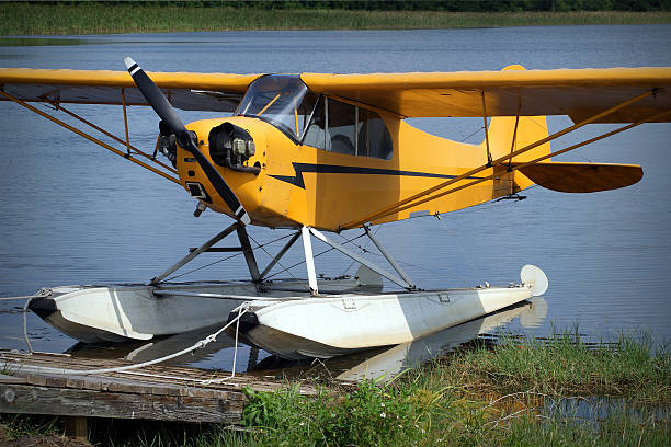 istock Yellow seaplane standing at a lake 612265158