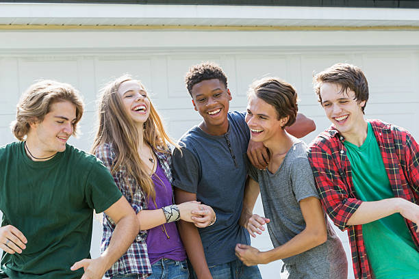 istock Multi-ethnic teenagers hanging out having fun 612266730