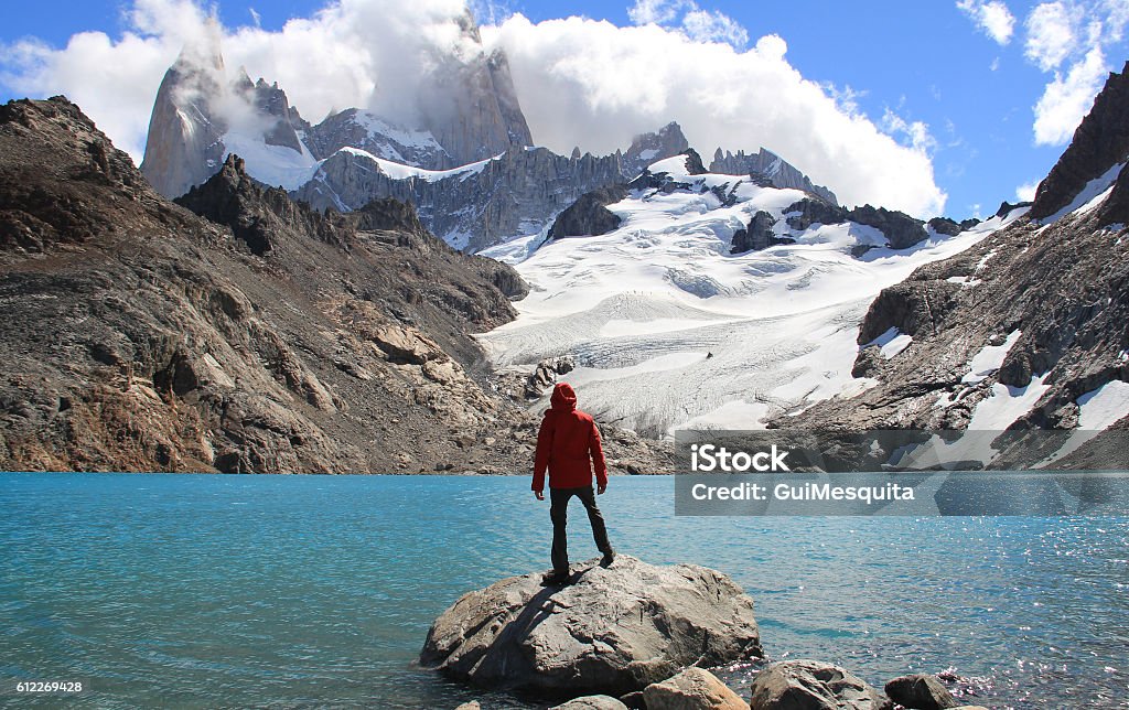 Patagonia Man, blue lake, glacier and mountains. El Chalten (Argentina's Trekking Capital) - Patagonia Argentina Stock Photo