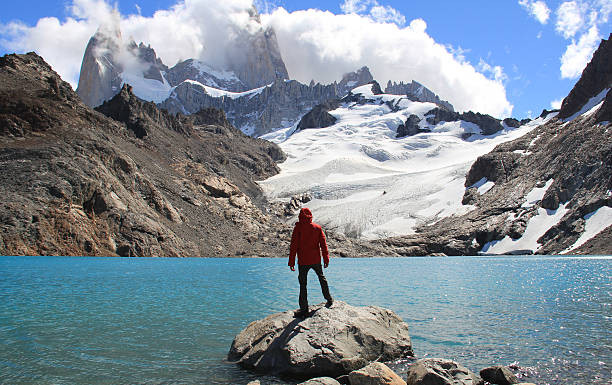 Patagonia Man, blue lake, glacier and mountains. El Chalten (Argentina's Trekking Capital) - Patagonia fitzroy range stock pictures, royalty-free photos & images