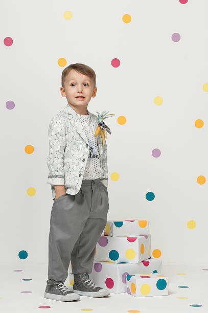 istock little boy in a suit 612369560