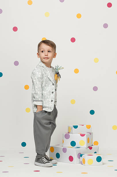 istock little boy in a suit 612370120