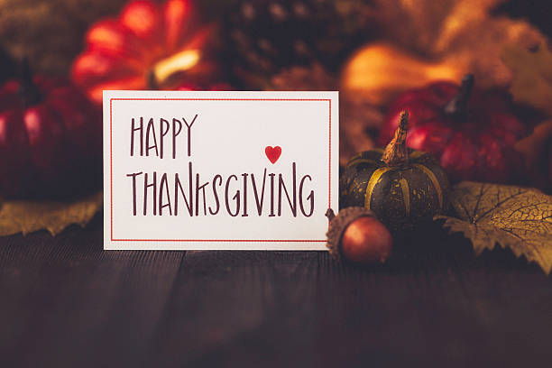 istock Thanksgiving still life background with pumpkins, acorns and message 612370520