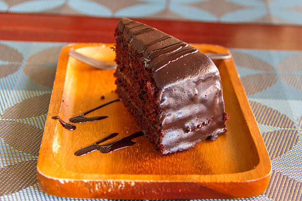 istock Chocolate cake placed on a wooden tray 612370716
