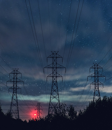 High voltage power lines under crisp and very clear Autumn night skies.  Long exposure.