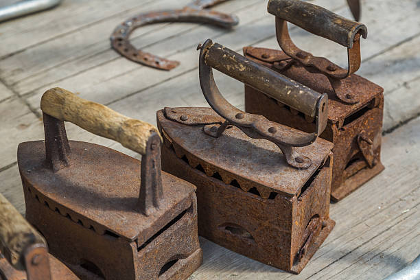 istock Old irons on wooden boards 612372456