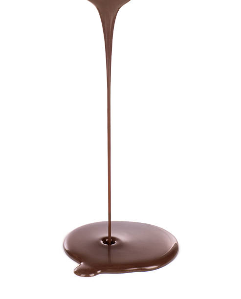 istock Hot melted chocolate pouring on white background 612374644