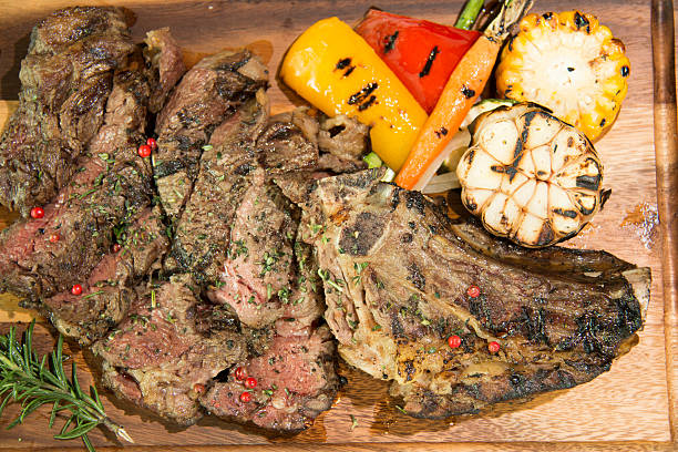 istock Deboned tomahawk rib steak with pepper sauce served with gratina 612375924