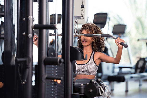 istock Woman exercise at gym. 612376252