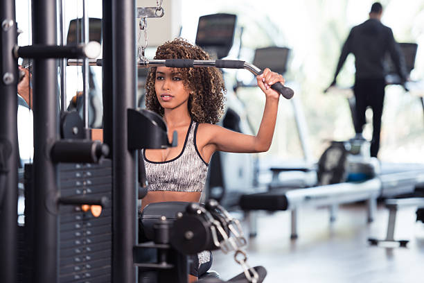 istock Ambitious athlete focuses on training weightlifting exercise. 612376592