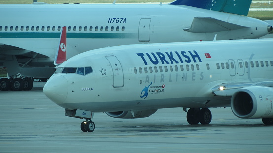 Atatürk Airport, Istanbul, Turkey - July 1, 2012 : A Turkish Airlines airplane taxiing on the runway at Istanbul Airport, Turkey.
