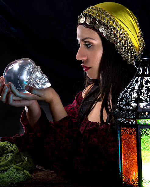 istock Psychic Holding a Crystal Skull 612377332