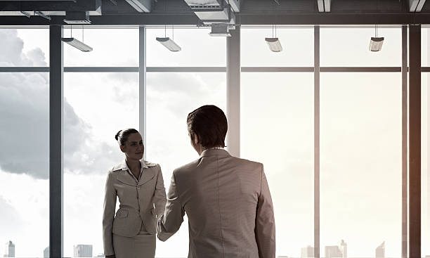 istock Business partners handshake . Mixed media 612379048