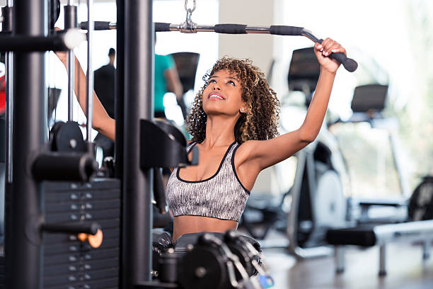 istock Ambitious athlete focuses on training weight lifting exercise. 612379110