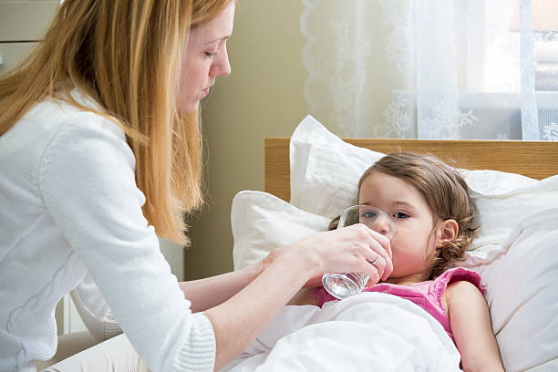 istock Sick child with high fever 612380194
