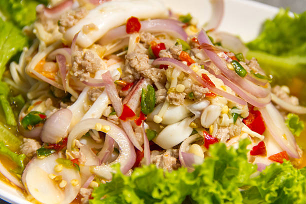 istock spicy salad with pork and vegetable 612380374