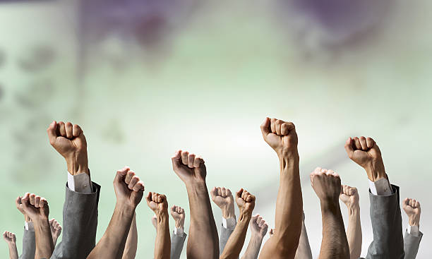 istock Group of people with raised hands . Mixed media 612381182