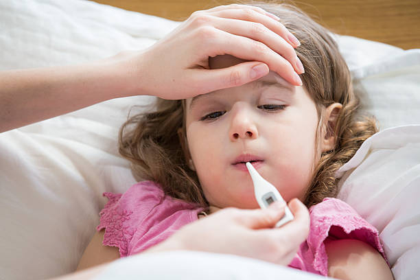 istock Sick child with high fever 612381418