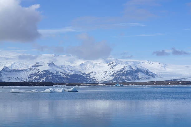 istock ice sheet on the water with snow mountain background 612382384