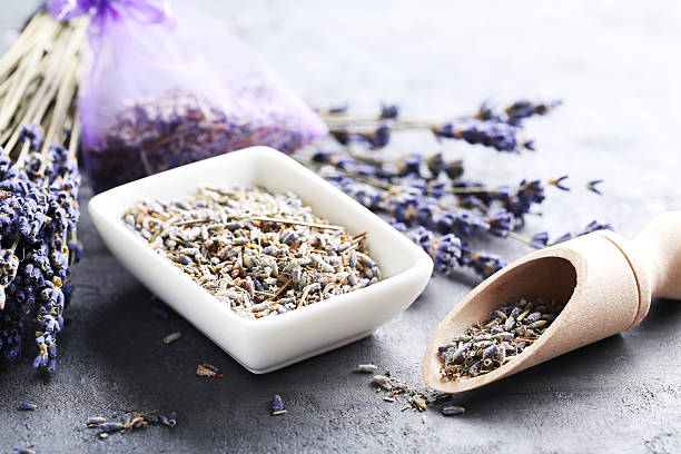 istock Lavender flowers in bowl and scoop on grey table 612382988