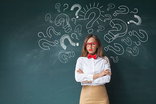 istock Businesswoman with question marks 612383042