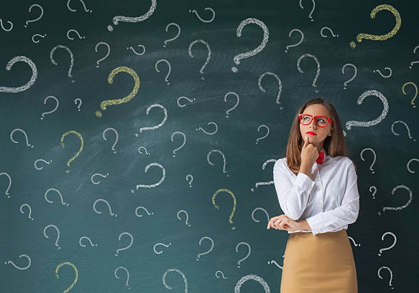 istock Businesswoman with question marks 612383278