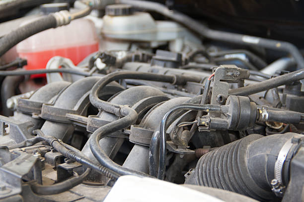 istock Car engine under the open hood and dust 612384724