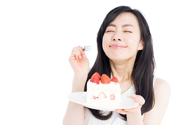 ケーキを食べる女性 - ケーキ ストックフォトと画像