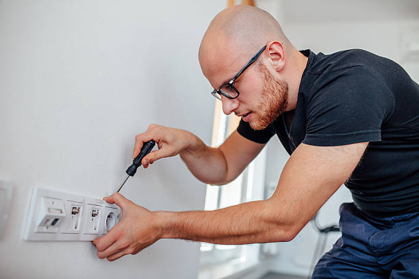 Man is repairing contacts. stock photo