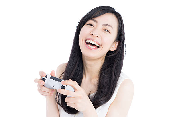 istock Woman playing video games 612385664