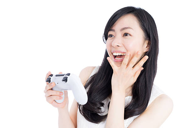 istock Woman playing video games 612385932