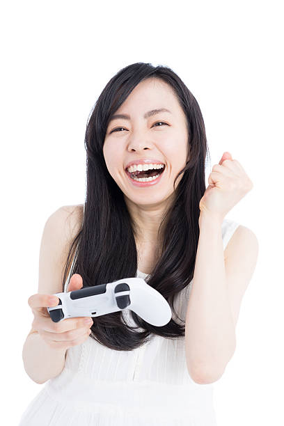 istock Woman playing video games 612386106