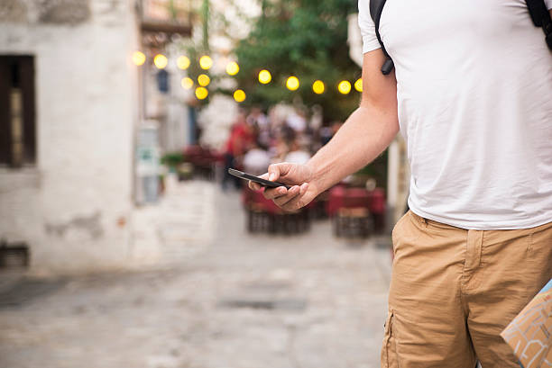 istock Man is playing on his mobile phone in the outdoor 612387670