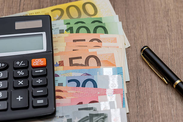 istock euro, calculator and pen on desk 612388056