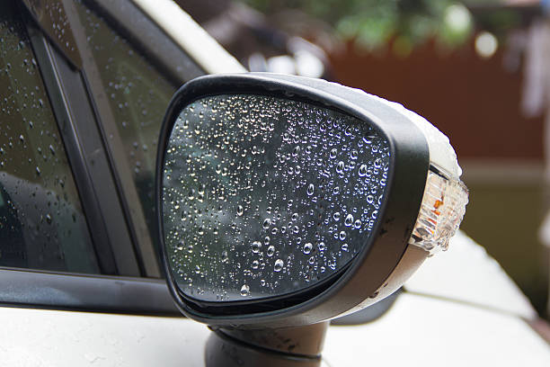 istock Water droplets on a car rear-view mirror 612388736