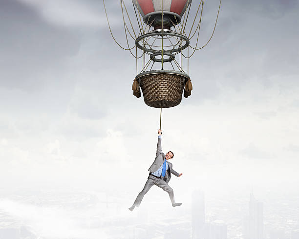 istock Man traveling in aerostat . Mixed media 612389560