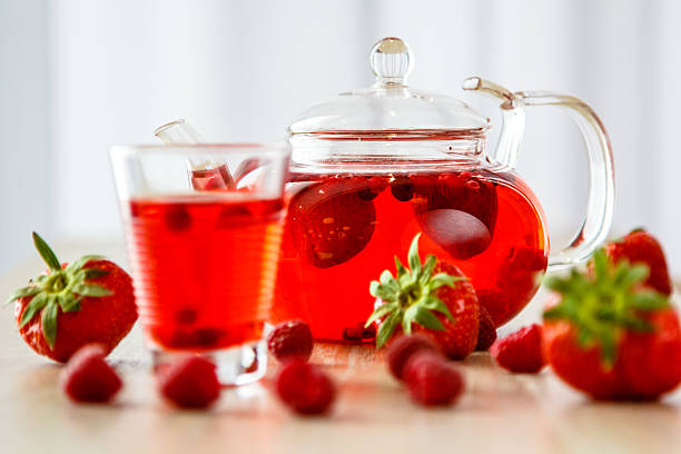 istock Tea in a glass teapot from the strawberries 612389742
