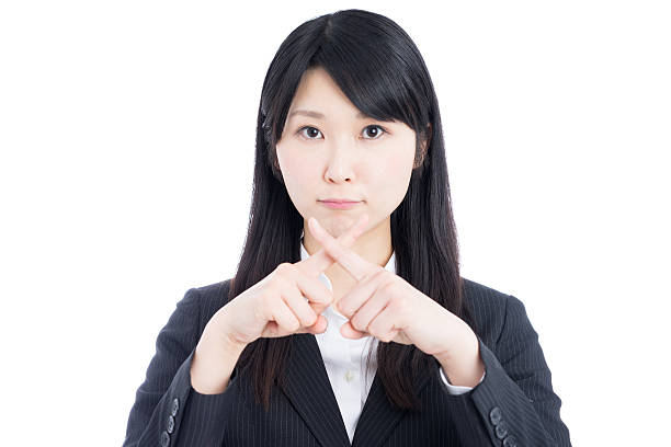 istock Businesswoman making x sign 612390050