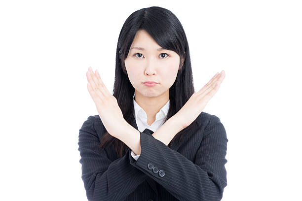 istock Businesswoman making x sign 612390074