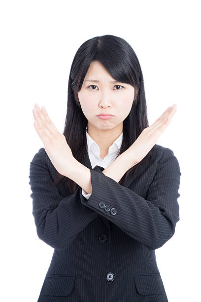 istock Businesswoman making x sign 612390132