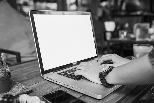 istock young woman using laptop at coffee shop 612390528