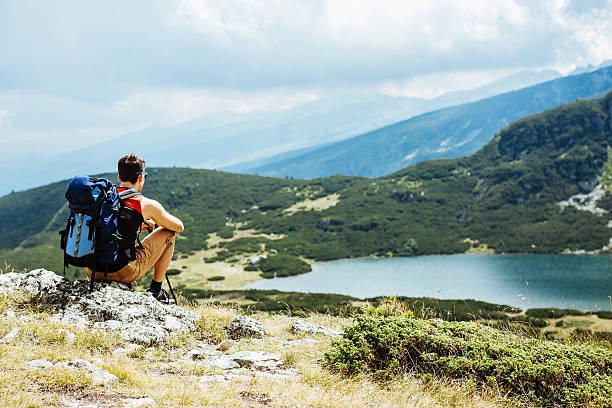 istock Hiker contemplating serene scenery 612391750