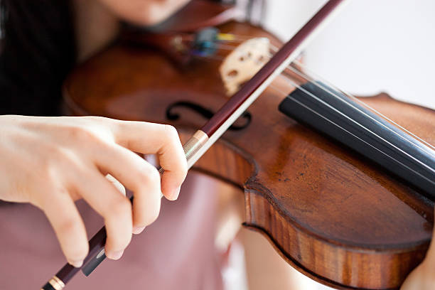 istock Japanese woman playing a violin 612392710