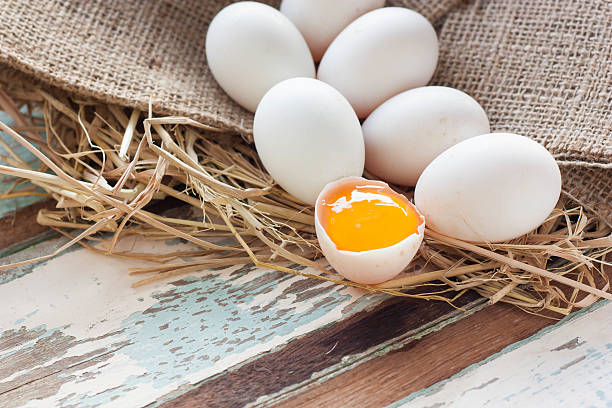 istock Organic white eggs on vintage wooden background. 612393648