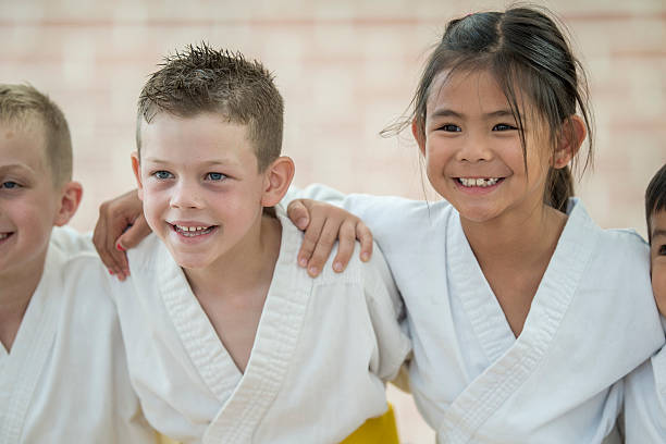 istock Friends Taking a Martial Arts Class 612395020