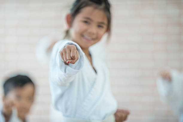 istock Young Girl Taking Karate 612395076