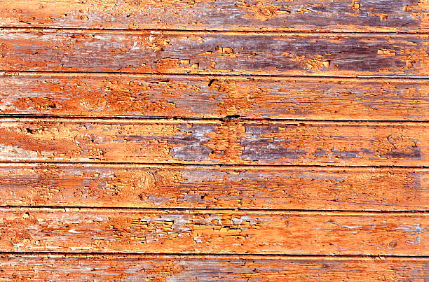 istock Orange weathered wood house wall 612395202