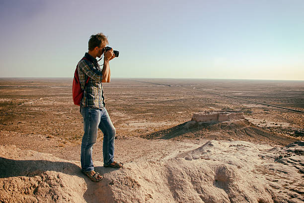istock Tourist photographer in Khwarezm 612395624